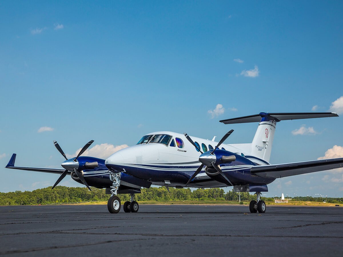 Beechcraft King Air on the ramp during a sunny day.